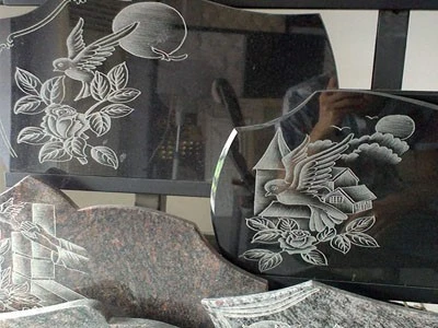 Laser engraving flowers on marble